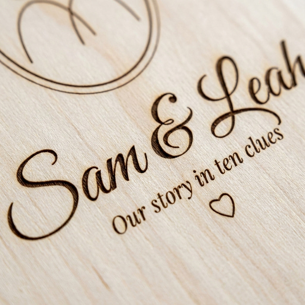 Close-up of laser-engraved script names on birch plywood