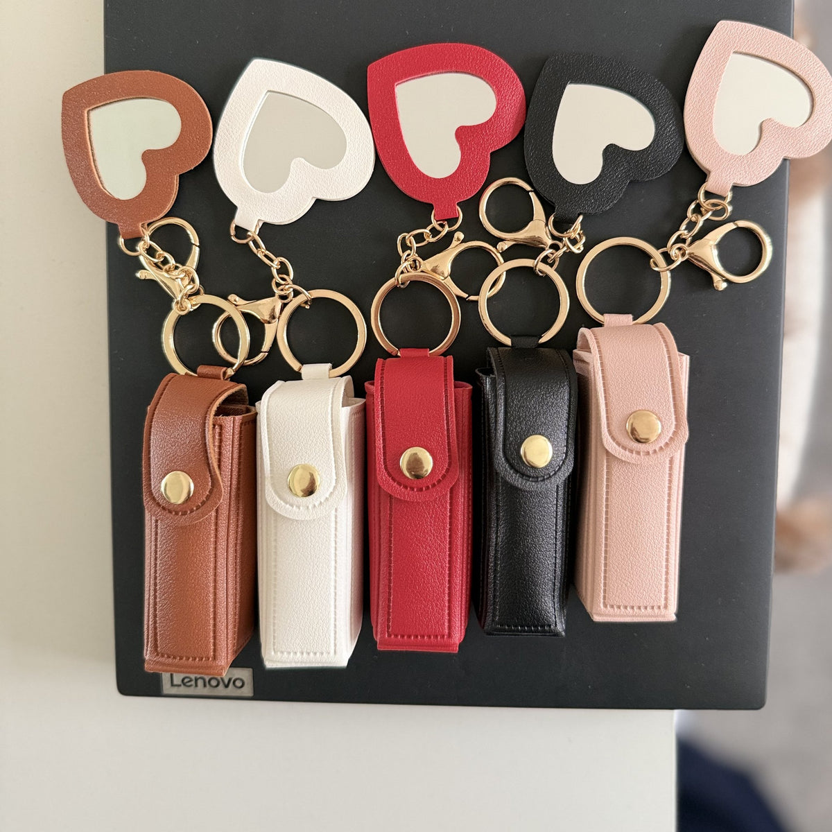 Lipstick holder keyrings with heart mirror charms in five colours