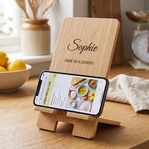 Engraved phone stand holding a phone with a recipe in the kitchen