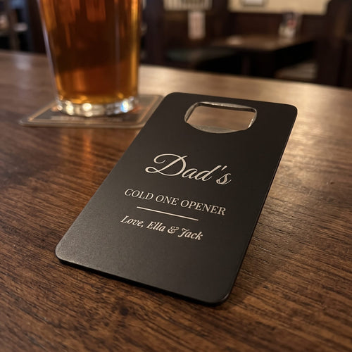 Engraved bottle opener card on a pub table