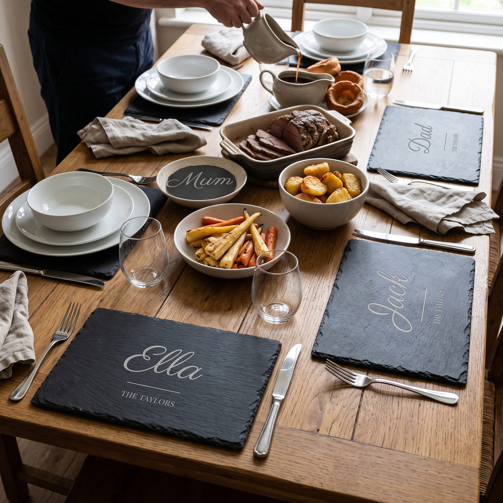 Family dining table laid with engraved slate placemats