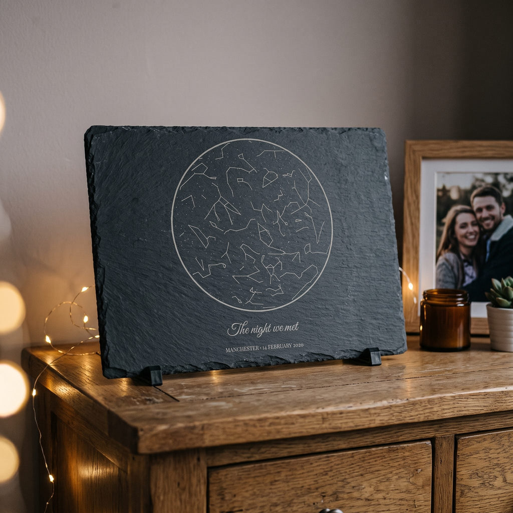 Engraved star map slate reading The night we met on a bedroom chest of drawers