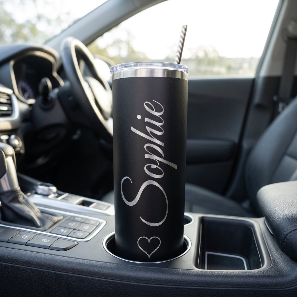 Black skinny tumbler engraved Sophie in a car cup holder