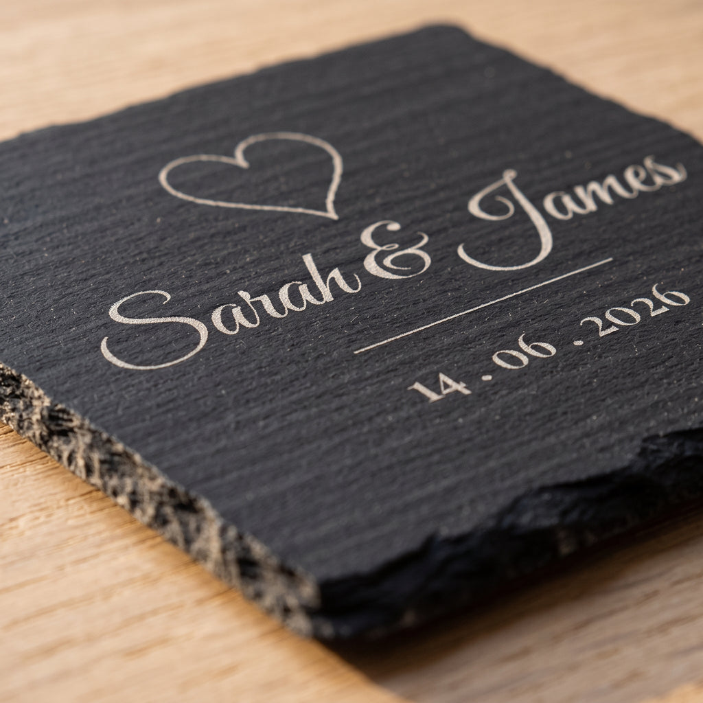 Close-up of the pale grey laser engraving on natural slate