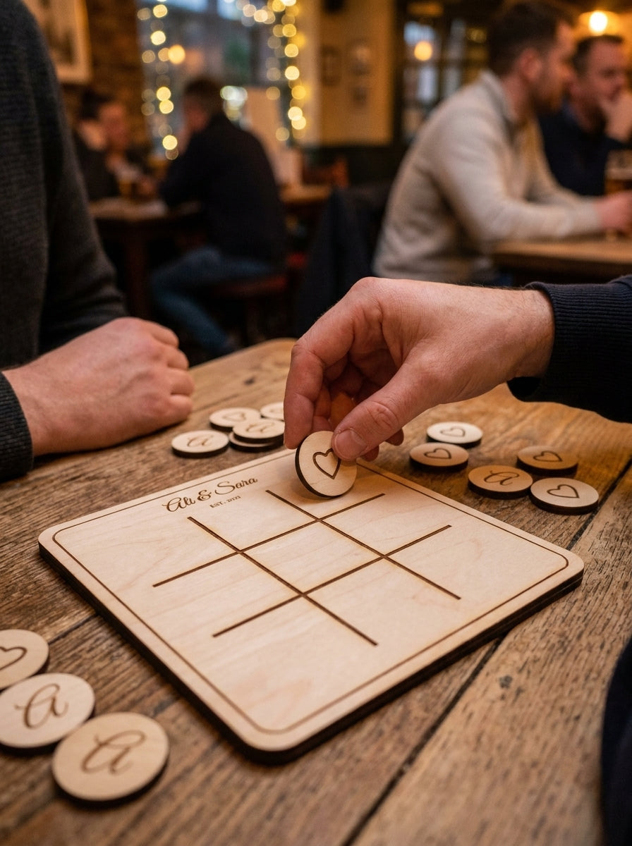 Personalised noughts & crosses set being played by a couple on a pub table