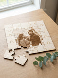 Personalised photo jigsaw puzzle with a couple's photo and names, pieces lifted out beside eucalyptus